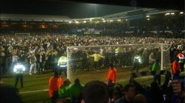 Luton Town fans invade the pitch to throw coins at Brighton supporters during the EFL Trophy meeting between the two sides at Kenilworth Road in 2009