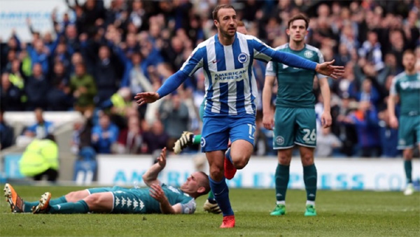 Glenn Murray opens the scoring against Wigan Athletic as Brighton won 2-1 to earn promotion to the Premier League