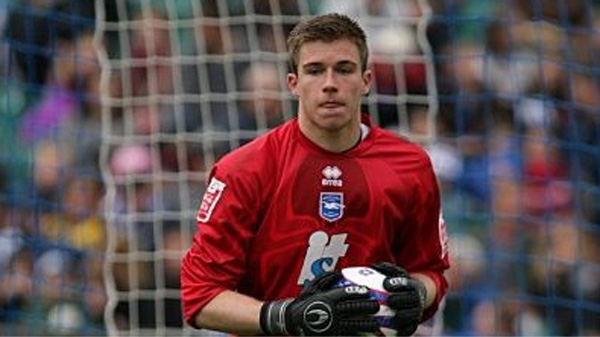 Mitch Walker wearing the red Spider Man goalkeeper shirt from the 2010-11 season