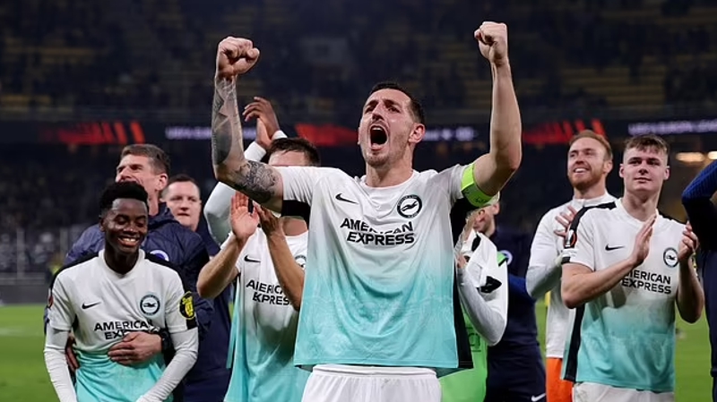 Lewis Dunk celebrates Brighton celebrating for the knockout round of the 2023-24 Europa League with a 1-0 November win at AEK Athens