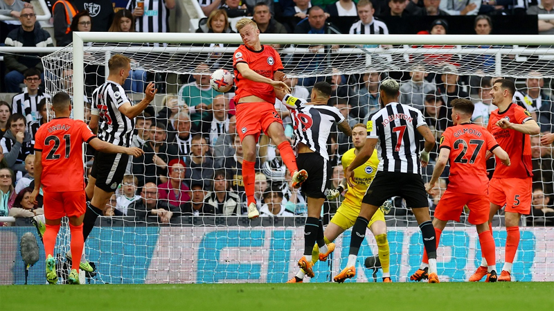 Dan Burn scores the second goal for Newcastle in their 4-1 win over Brighton