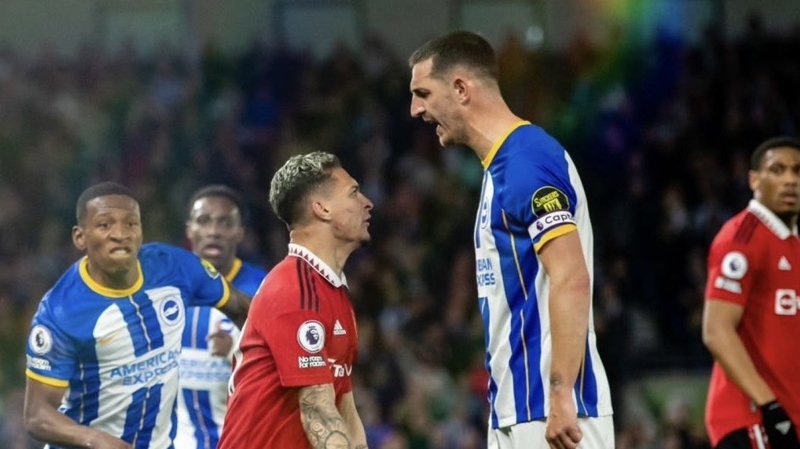 Lewis Dunk and Antony square up during Brighton and against Manchester United