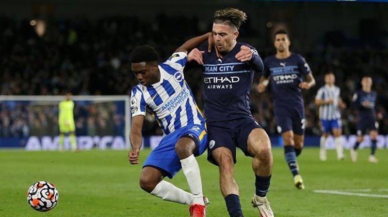 Tariq Lamptey takes on Jack Grealish during Brighton 1-4 Man City