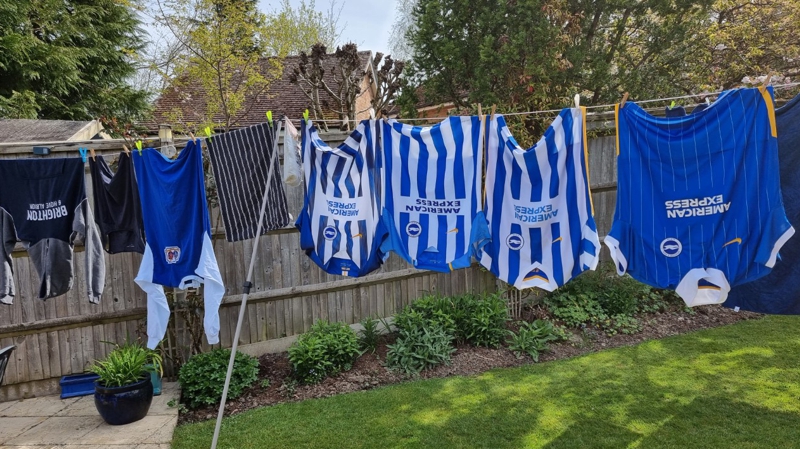 Brighton & Hove Albion replica shirts hung on a washing line