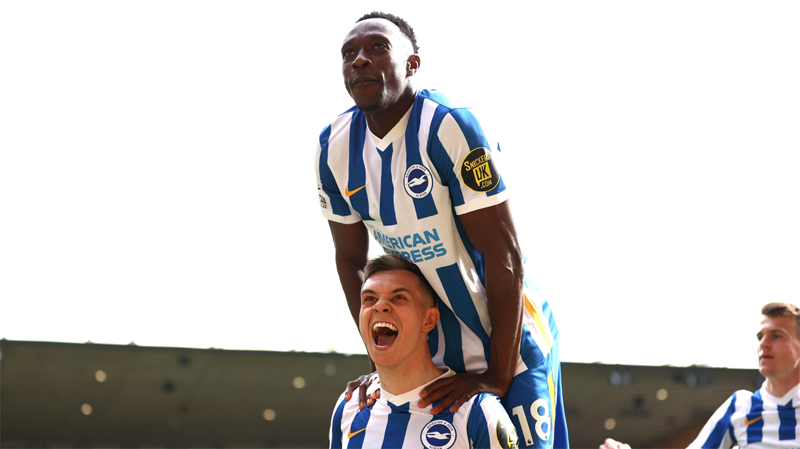 Leandro Trossard and Danny Welbeck celebrate a Brighton goal as the Albion win 3-0 at Wolves