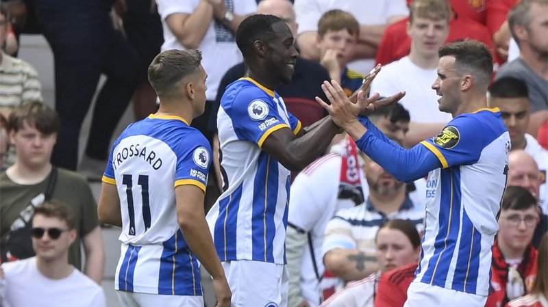 Pascal Gross, Danny Welbeck and Leandro Trossard celebrate a goal as Brighton beat Man United 2-1 at Old Trafford