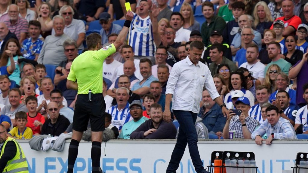 Jesse Marsch receives a booking as Leeds are beaten 1-0 by Brighton