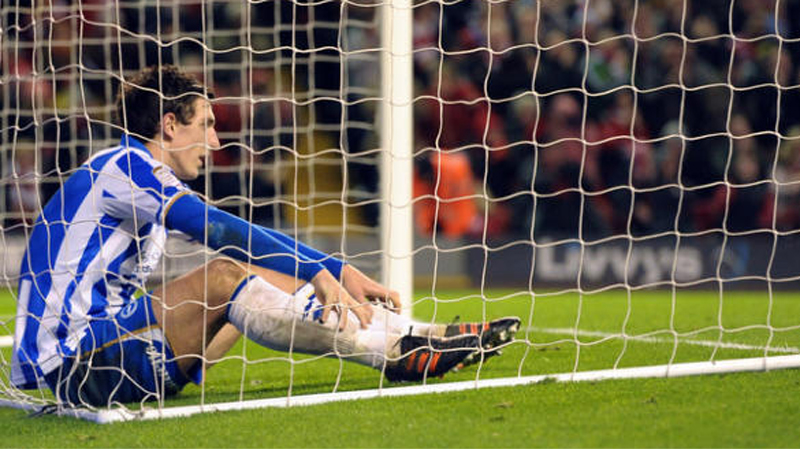 Lewis Dunk scored an own goal for Brighton away at Liverpool in the FA Cup